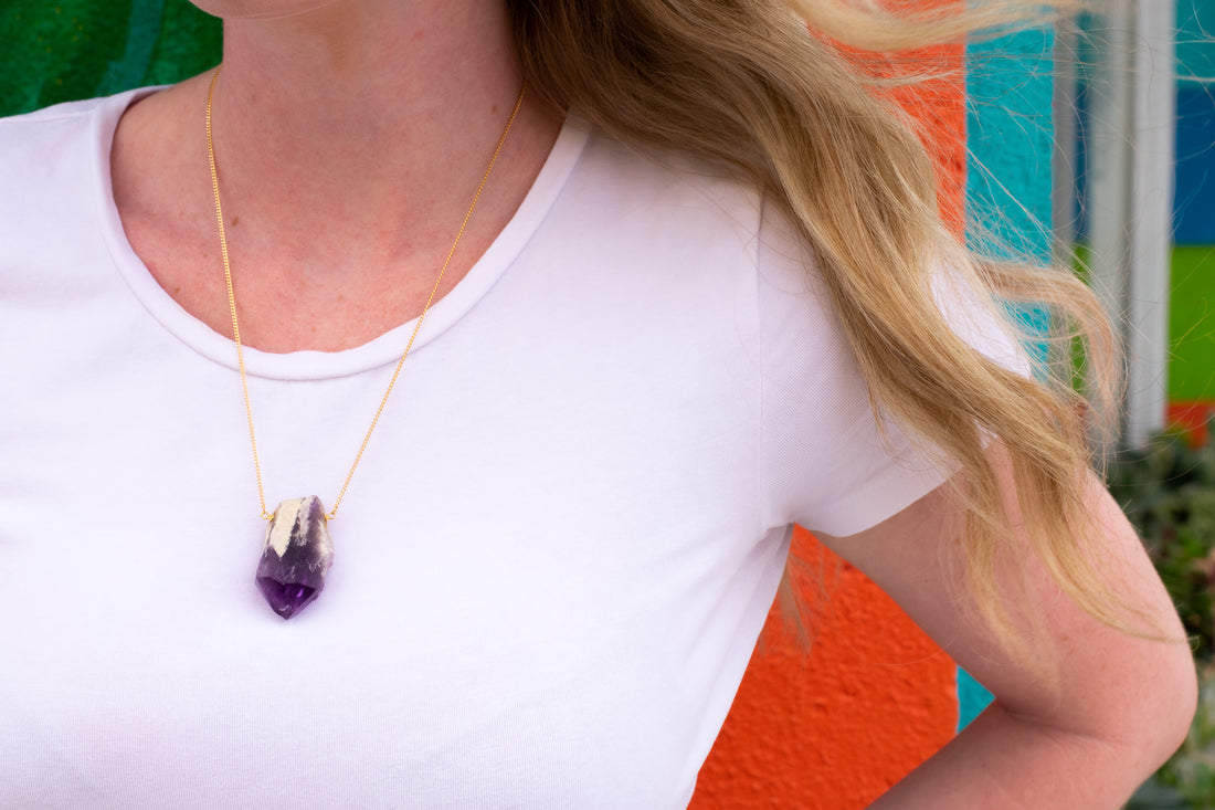 Amethyst Necklace over white shirt