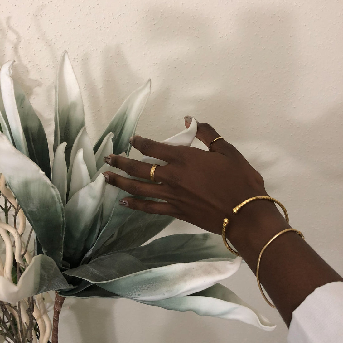 gold bracelets with flowers