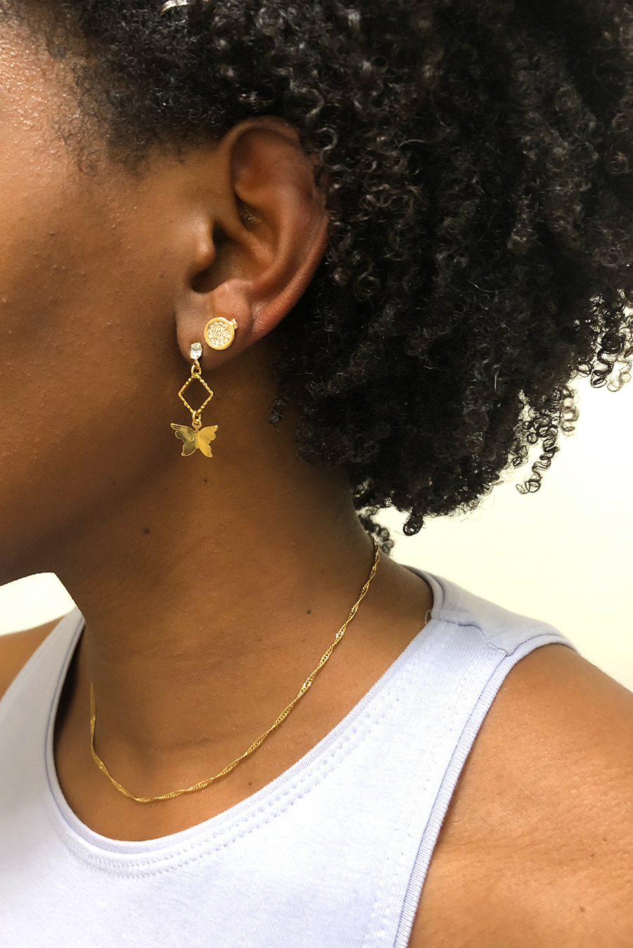 butterfly drop earrings on ear